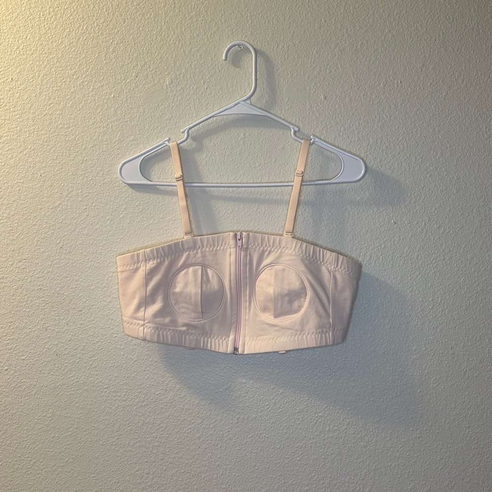 Light pink adjustable pumping bra.